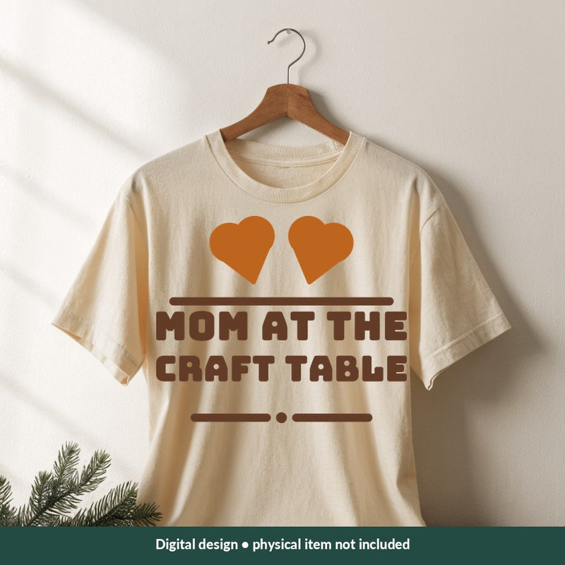 Mom at the Craft Table Mom-life digital design on a shirt; illustrative mockup, no physical product included